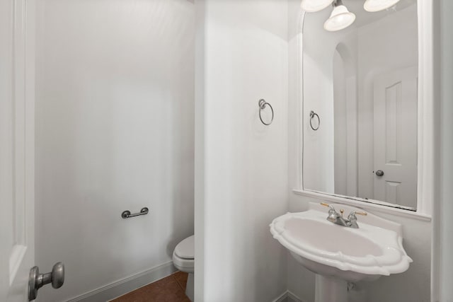 13202 Brushy Knoll Ln, Sugar Land, TX 77498 - bathroom with toilet, tile patterned floors, and a sink