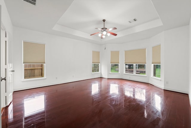 13202 Brushy Knoll Ln, Sugar Land, TX 77498 - spare room featuring a raised ceiling, a ceiling fan, baseboards, and wood finished floors