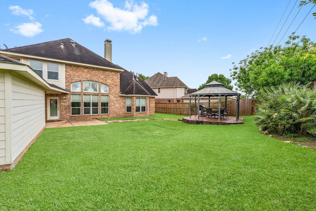 13202 Brushy Knoll Ln, Sugar Land, TX 77498 - back of house featuring a gazebo, a patio area, a chimney, and brick siding