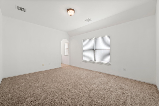 13202 Brushy Knoll Ln, Sugar Land, TX 77498 - spare room featuring carpet, arched walkways, and baseboards
