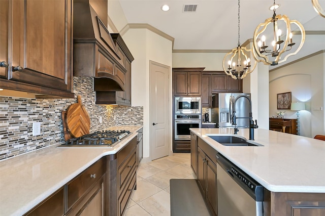 1530 Richland Hollow Ln, Friendswood, TX 77546 - kitchen featuring stainless steel appliances, a sink, a chandelier, light countertops, and recessed lighting