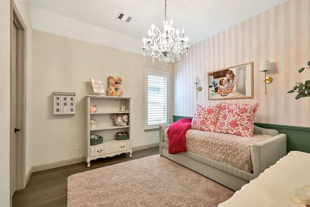 1530 Richland Hollow Ln, Friendswood, TX 77546 - bedroom with a chandelier, wood finished floors, wallpapered walls, and baseboards