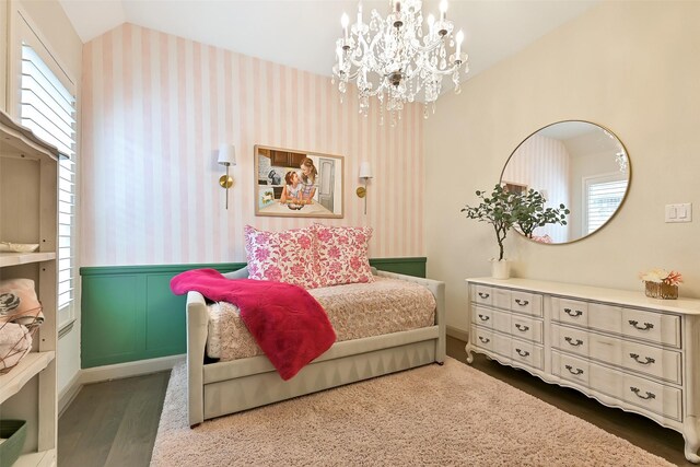 1530 Richland Hollow Ln, Friendswood, TX 77546 - bedroom with wallpapered walls, wood finished floors, multiple windows, vaulted ceiling, and a chandelier