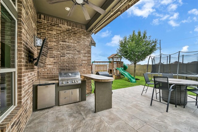 1530 Richland Hollow Ln, Friendswood, TX 77546 - view of patio with a trampoline, ceiling fan, and a playground