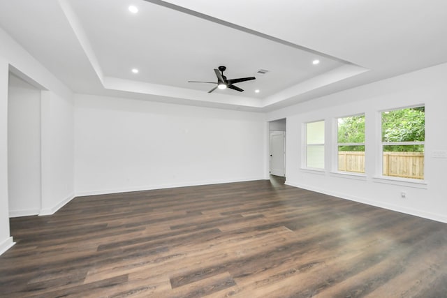 7440 Avenue E Ave E, Beasley, TX 77417 - spare room with a tray ceiling, recessed lighting, baseboards, dark wood-style flooring, and a ceiling fan