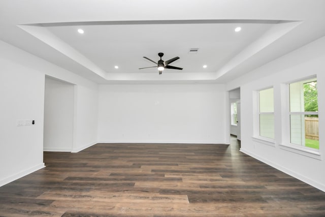 7440 Avenue E Ave E, Beasley, TX 77417 - spare room featuring a raised ceiling, recessed lighting, ceiling fan, dark wood-type flooring, and baseboards