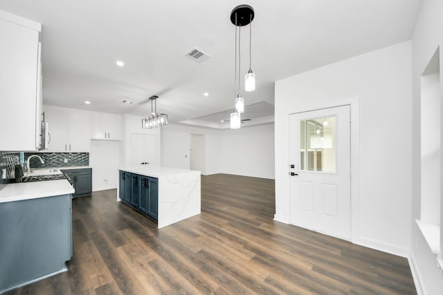 7440 Avenue E Ave E, Beasley, TX 77417 - kitchen with a sink, decorative light fixtures, dark wood-type flooring, tasteful backsplash, and recessed lighting