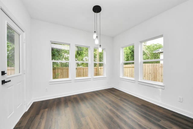 7440 Avenue E Ave E, Beasley, TX 77417 - unfurnished dining area featuring healthy amount of natural light, baseboards, and dark wood-type flooring