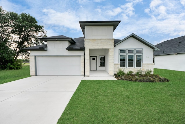 7440 Avenue E Ave E, Beasley, TX 77417 - modern home with stone siding, a front yard, concrete driveway, an attached garage, and stucco siding