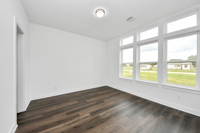 7440 Avenue E Ave E, Beasley, TX 77417 - unfurnished room featuring dark wood-style flooring and baseboards