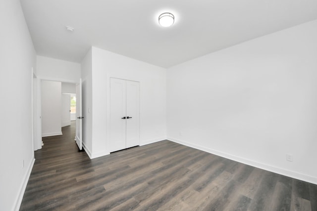 7440 Avenue E Ave E, Beasley, TX 77417 - empty room with dark wood-style flooring and baseboards