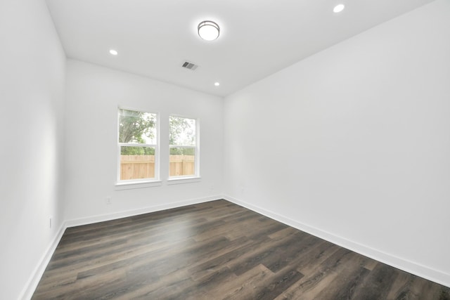 7440 Avenue E Ave E, Beasley, TX 77417 - empty room with recessed lighting, dark wood-style floors, and baseboards