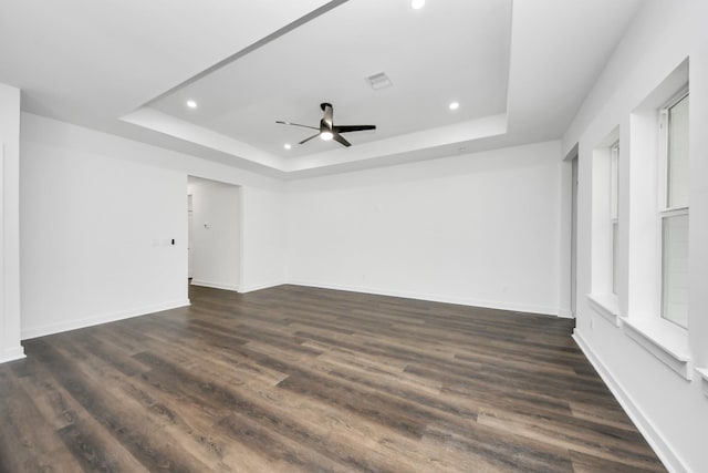 7440 Avenue E Ave E, Beasley, TX 77417 - spare room with a tray ceiling, recessed lighting, baseboards, and dark wood-style floors