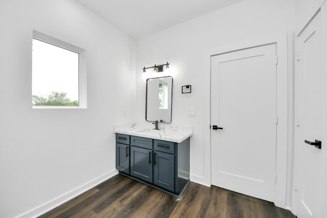7440 Avenue E Ave E, Beasley, TX 77417 - bathroom featuring vanity, wood finished floors, and baseboards