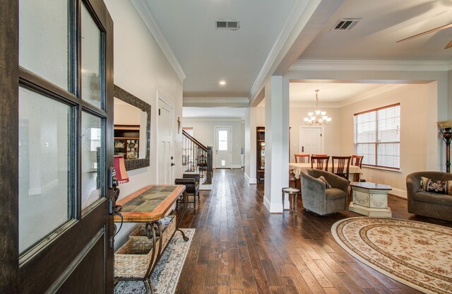 4303 Jonathan St, Bellaire, TX 77401 - living area with dark wood-style flooring, stairs, baseboards, ornamental molding, and a chandelier