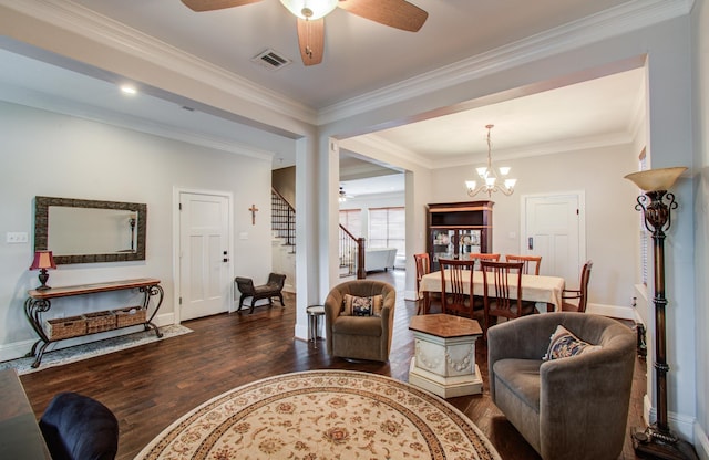 4303 Jonathan St, Bellaire, TX 77401 - living room with ceiling fan, wood finished floors, stairway, baseboards, and crown molding