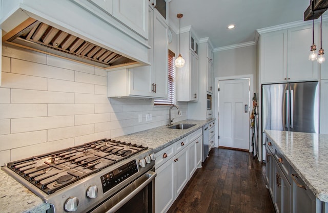 4303 Jonathan St, Bellaire, TX 77401 - kitchen featuring appliances with stainless steel finishes, premium range hood, a sink, crown molding, and white cabinets