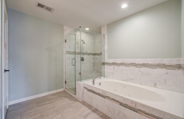 4303 Jonathan St, Bellaire, TX 77401 - full bathroom featuring a jetted tub, a shower stall, recessed lighting, and baseboards