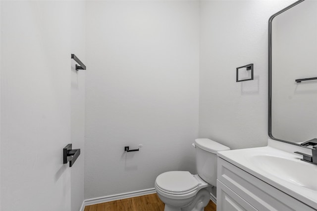 20419 Thunder Ridge Ln, Katy, TX 77449 - bathroom with wood finished floors, baseboards, vanity, and toilet