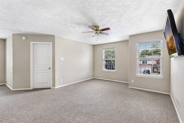 703 Windlass Way, Crosby, TX 77532 - carpeted spare room with ceiling fan, baseboards, and a textured ceiling