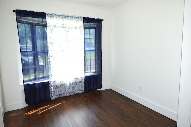 405 W Jack St, Baytown, TX 77520 - unfurnished room featuring dark wood-style floors and baseboards