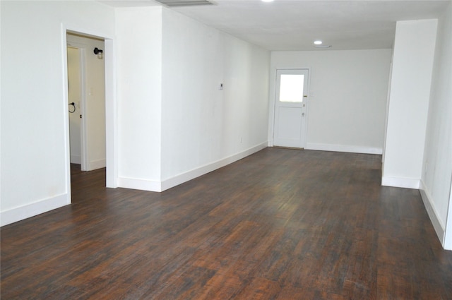 405 W Jack St, Baytown, TX 77520 - unfurnished room featuring dark wood-style floors, baseboards, and recessed lighting