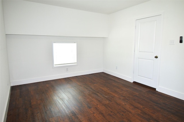 405 W Jack St, Baytown, TX 77520 - spare room with dark wood-style floors and baseboards