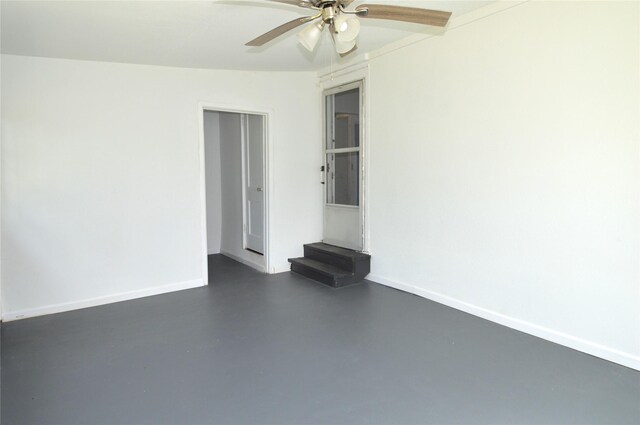 405 W Jack St, Baytown, TX 77520 - empty room featuring finished concrete floors, a ceiling fan, and baseboards