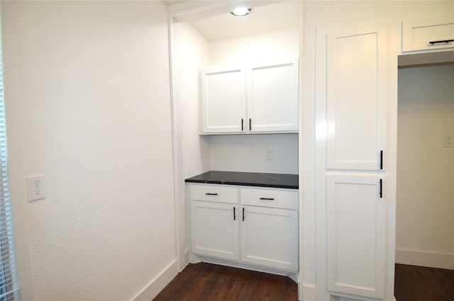 405 W Jack St, Baytown, TX 77520 - bar area featuring dark wood-style flooring and baseboards