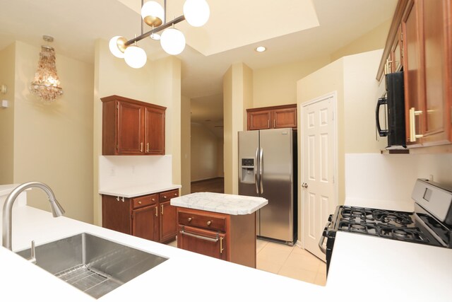 8006 Virginia Water Ln, Houston, TX 77095 - kitchen with appliances with stainless steel finishes, light countertops, light tile patterned floors, recessed lighting, and a center island