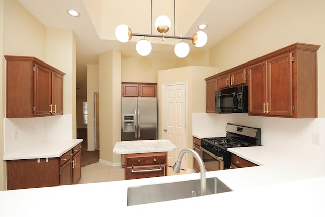8006 Virginia Water Ln, Houston, TX 77095 - kitchen featuring appliances with stainless steel finishes, light countertops, hanging light fixtures, light tile patterned flooring, and recessed lighting