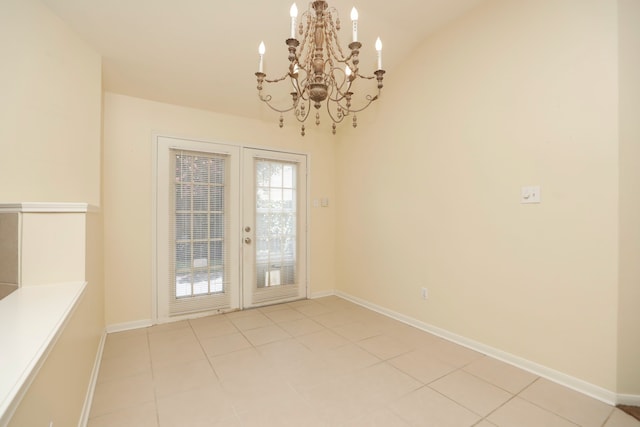 8006 Virginia Water Ln, Houston, TX 77095 - unfurnished dining area featuring a chandelier, french doors, and light tile patterned floors