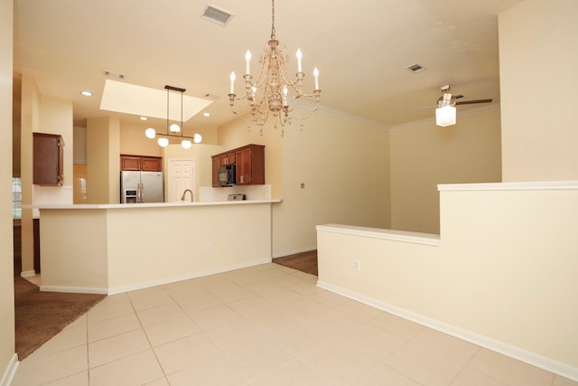 8006 Virginia Water Ln, Houston, TX 77095 - kitchen featuring stainless steel refrigerator with ice dispenser, black microwave, a chandelier, recessed lighting, and a peninsula