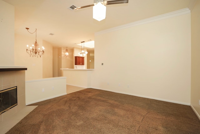 8006 Virginia Water Ln, Houston, TX 77095 - unfurnished living room featuring a chandelier, light colored carpet, a fireplace, ornamental molding, and a ceiling fan