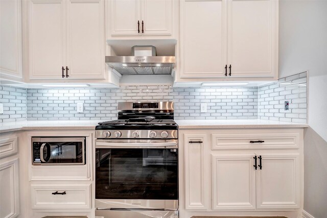 234 Feldspar Ln, Huntsville, TX 77340 - kitchen featuring stainless steel range with gas stovetop, built in microwave, exhaust hood, and light countertops