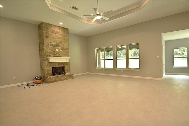 234 Feldspar Ln, Huntsville, TX 77340 - unfurnished living room with recessed lighting, a fireplace, light colored carpet, ceiling fan, and a tray ceiling