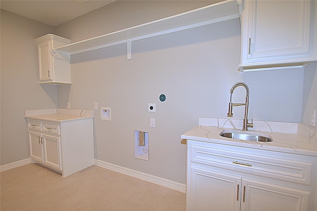 234 Feldspar Ln, Huntsville, TX 77340 - laundry room with hookup for an electric dryer, hookup for a washing machine, cabinet space, and light wood-style floors