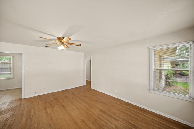 5814 Darnell St, Houston, TX 77074 - empty room featuring wood finished floors, ceiling fan, and baseboards