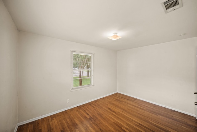5814 Darnell St, Houston, TX 77074 - spare room featuring wood finished floors and baseboards