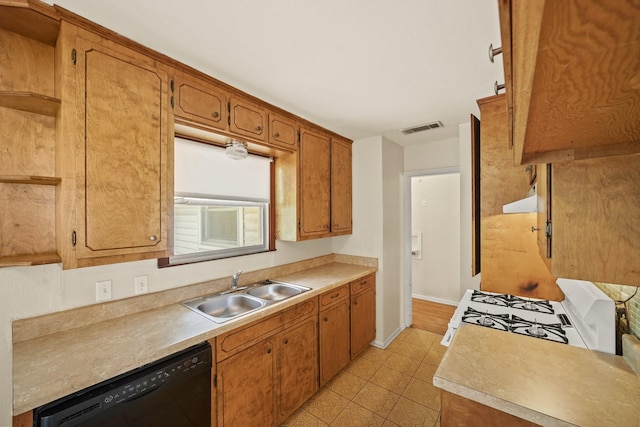 5814 Darnell St, Houston, TX 77074 - kitchen with a sink, dishwasher, white gas range, light countertops, and brown cabinetry
