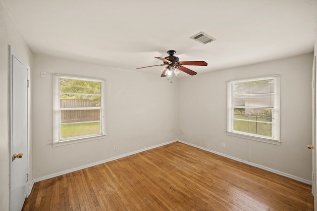 5814 Darnell St, Houston, TX 77074 - empty room featuring wood-type flooring, a ceiling fan, and baseboards
