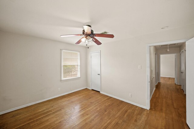 5814 Darnell St, Houston, TX 77074 - unfurnished room with attic access, a ceiling fan, wood finished floors, and baseboards