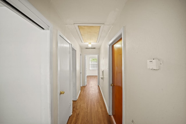 5814 Darnell St, Houston, TX 77074 - hall featuring attic access, light wood-style floors, and baseboards