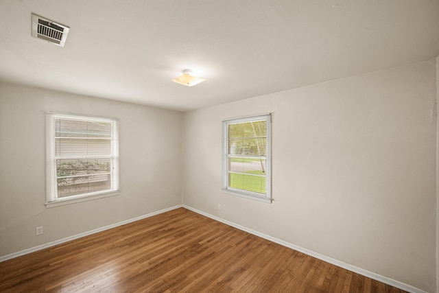 5814 Darnell St, Houston, TX 77074 - unfurnished room featuring wood-type flooring and baseboards