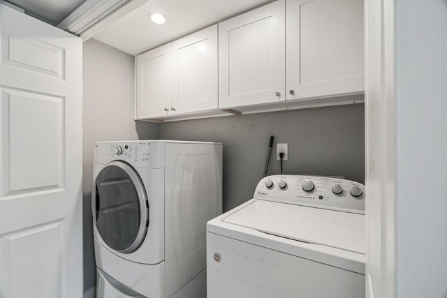 820 Threadneedle St Unit 248, Houston, TX 77079 - washroom with separate washer and dryer, cabinet space, and recessed lighting
