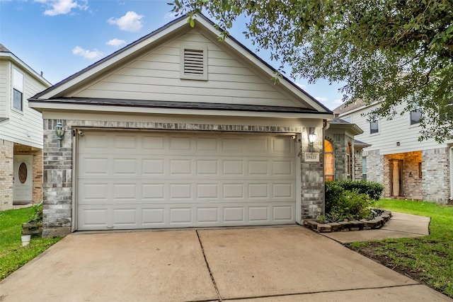 18423 Grove Brook Ln, Cypress, TX 77429 - view of front of house featuring concrete driveway, stone siding, and an attached garage