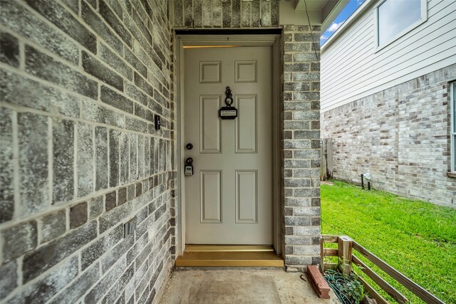 18423 Grove Brook Ln, Cypress, TX 77429 - view of exterior entry featuring brick siding