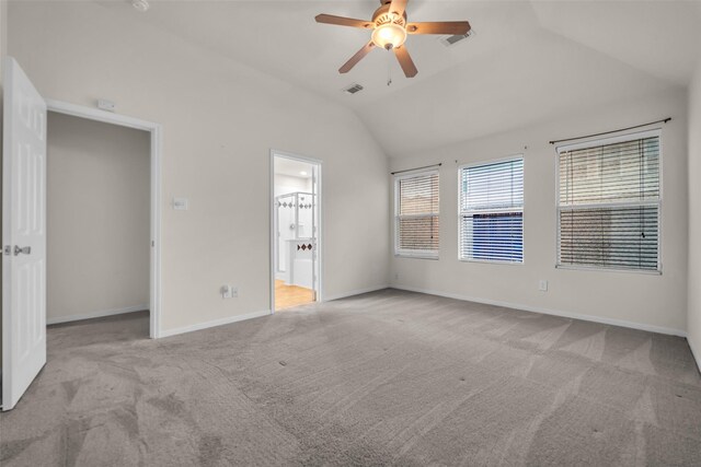 18423 Grove Brook Ln, Cypress, TX 77429 - unfurnished bedroom with lofted ceiling, carpet floors, ceiling fan, and ensuite bath