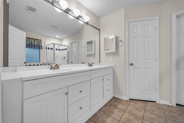 18423 Grove Brook Ln, Cypress, TX 77429 - bathroom with double vanity, tile patterned flooring, and a shower stall