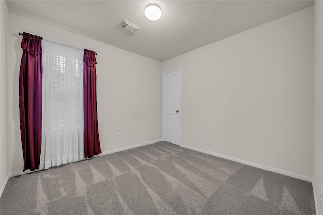 18423 Grove Brook Ln, Cypress, TX 77429 - carpeted spare room featuring baseboards and a textured ceiling